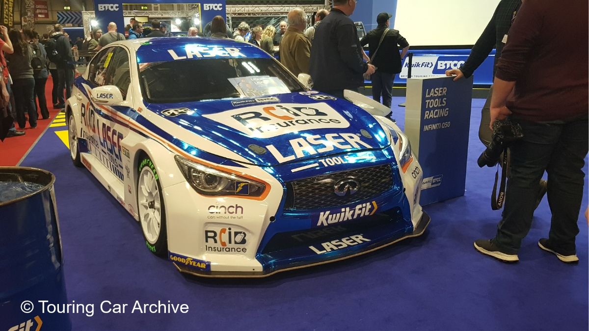 Front 3/4 photo of a white and blue Infiniti Q50 indoors at the NEC during the 2020 Autosport International Show